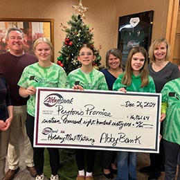 AbbyBank check presentation to Peyton's Promise for our 2024 Holiday Matching Donation Program.