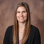 headshot for Rebecca Kuczer, Branch Manager for Shawano AbbyBank on brown background