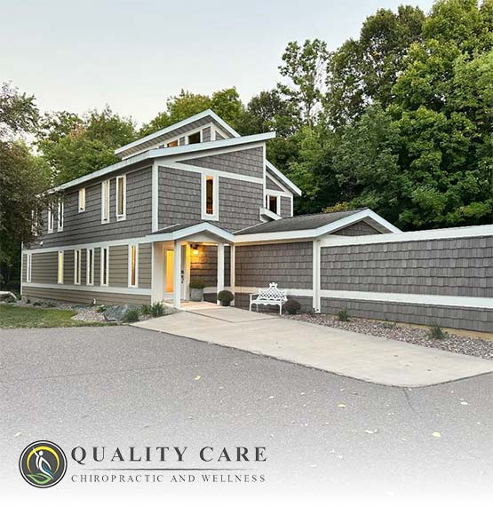 image of Quality Care Chiropractic building in Medford, WI with their logo overlayed the bottom left corner