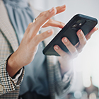 business woman scrolling or typing on mobile phone