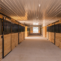 horse barn stalls inside custom barn built by Quality Construction in Bonduel, Wisconsin