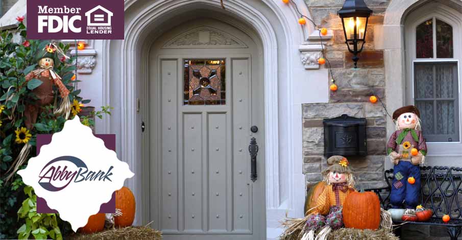 front door of house with fall decorations out front