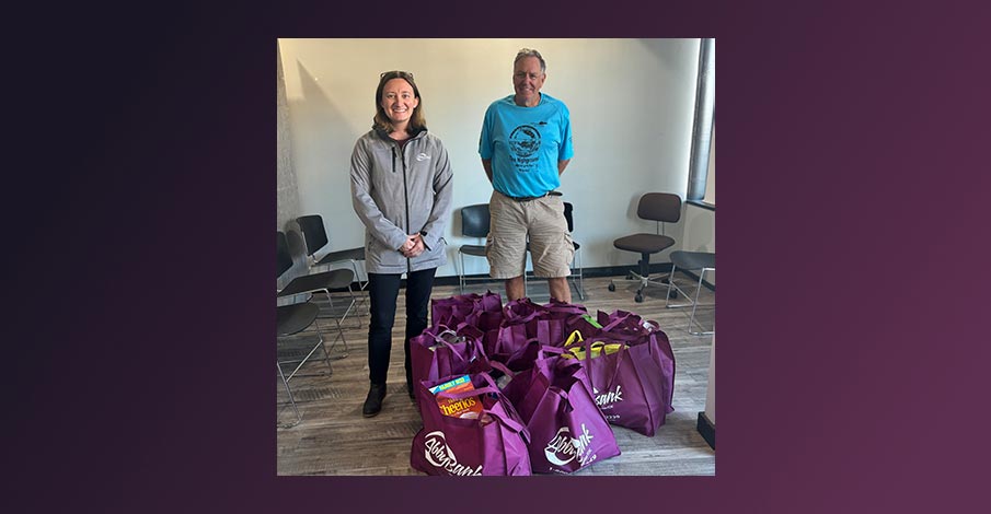 AbbyBank bags of food collected for Loyal Food Pantry on purple gradient background