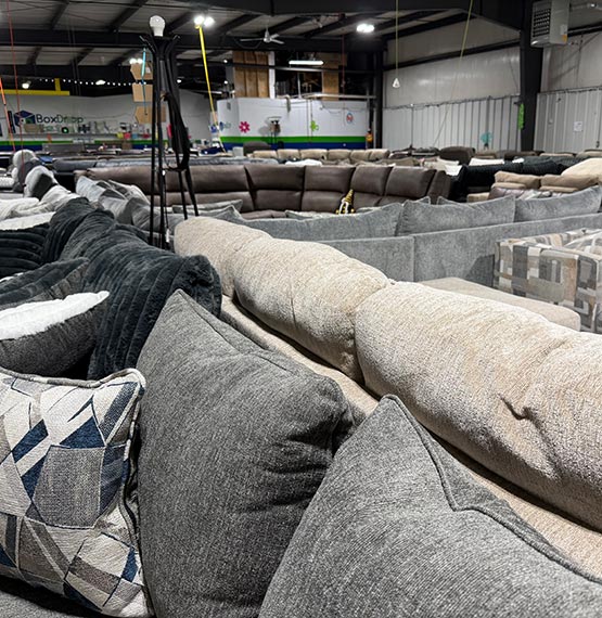BoxDrop warehouse full of couches and other furnishings