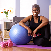 African American smiling while resting after a home workout