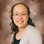 close-up of Marisol Garcia, Universal Banker in Abbotsford, against brown background