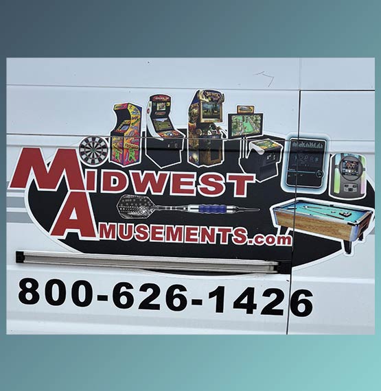 close-up of Midwest Amusements information on a vehicle on a gradient blue background