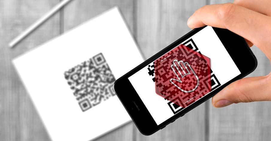 person scanning a random QR code with smartphone and a red stop warning sign over the QR code on the phone