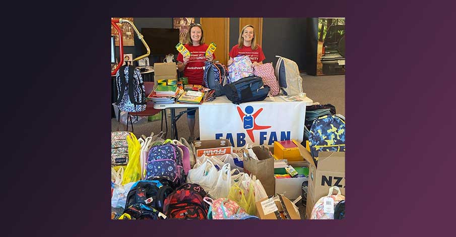 Gail and Natalyn smiling for FABFAN picture at J&D Tube Benders with donated school supplies 